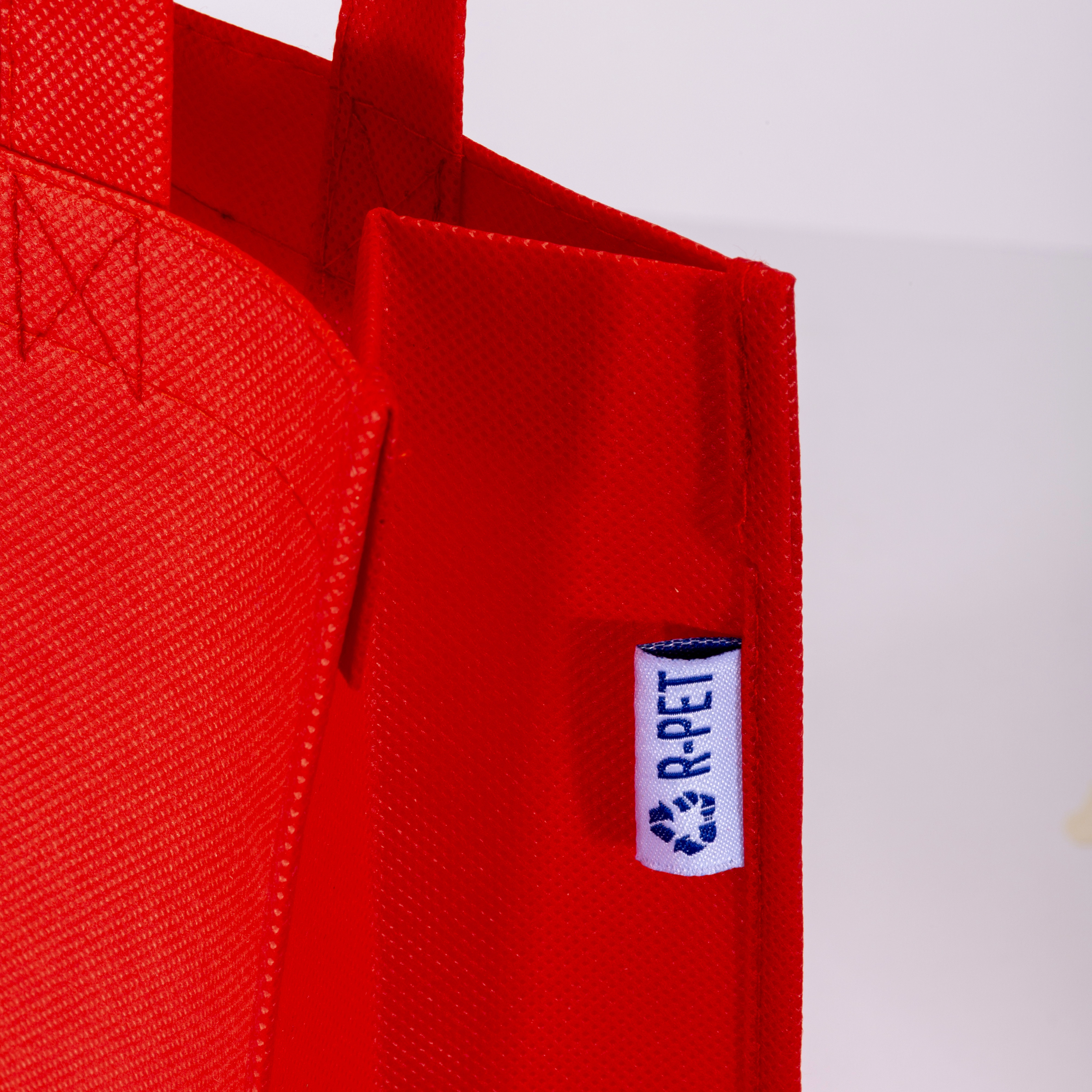 Immagine Shopper mini con soffietto in R-pet 80 g/m2 con soffietto, manici corti