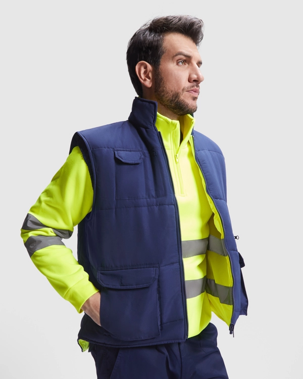Immagine PERSEI - Gilet reversibile multitasche alta visibilità con collo alto.